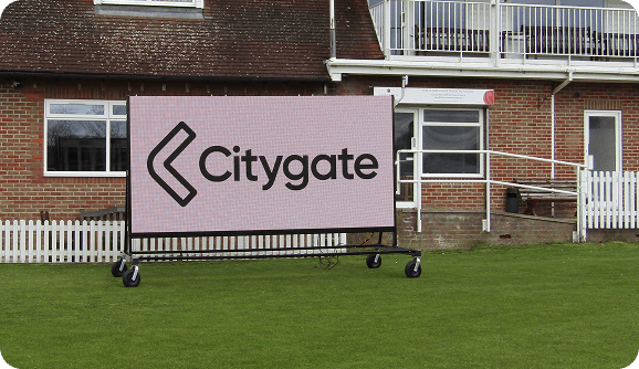 Portable LED scoreboard on mobile stands for flexible placement.